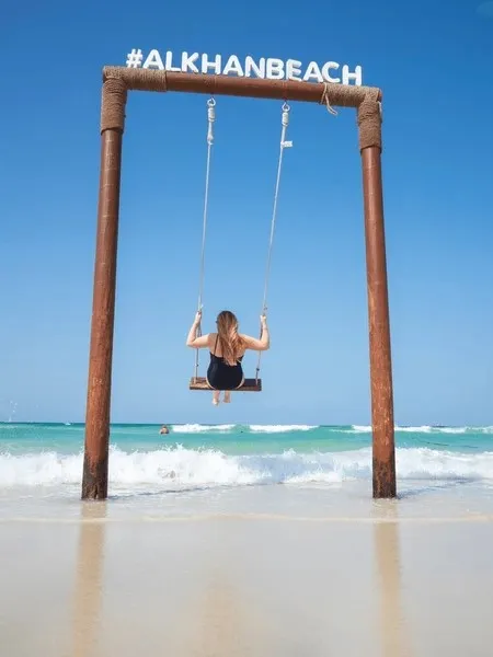 woman-swings-on-swing-seashore-600nw-2264060661.jpeg